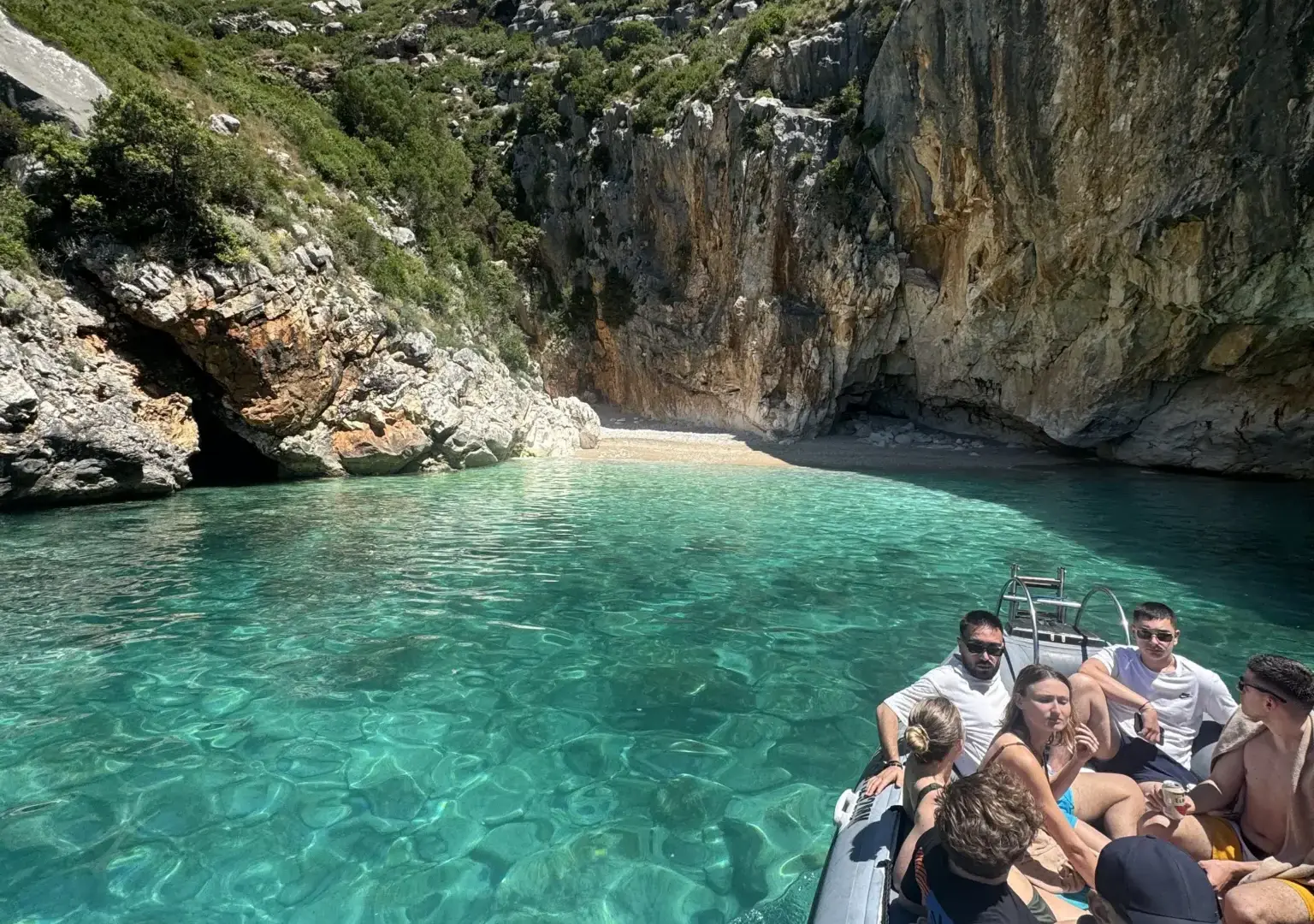 Turquoise water and the rocky coastline at Dafina Bay
